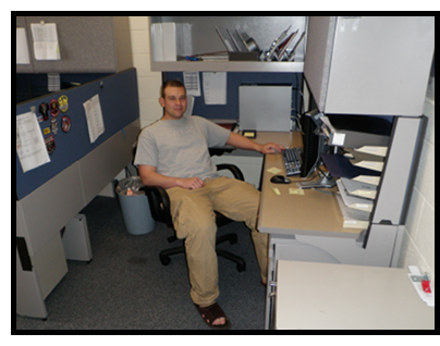 Anthony sitting at his desk